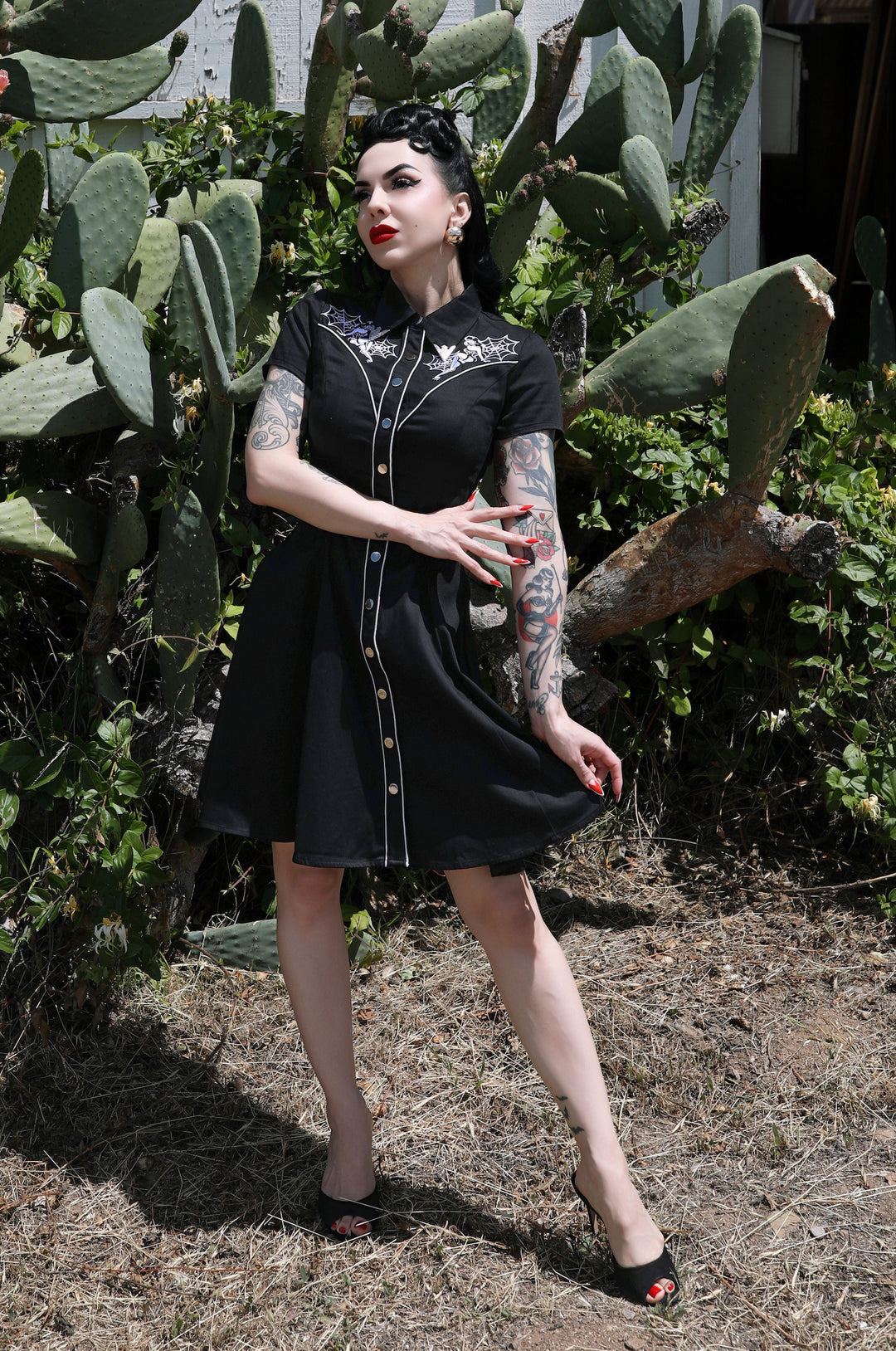 princess polly baby blue dress A black dress with a belt that says pinup on it main image 1